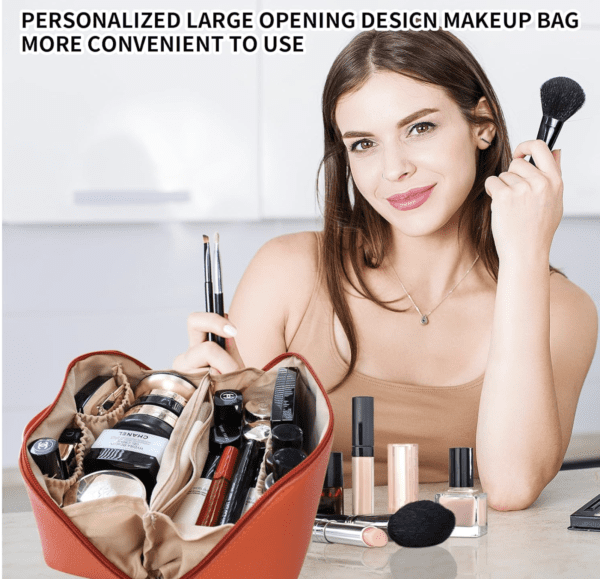 A woman holding makeup brushes in her hand.